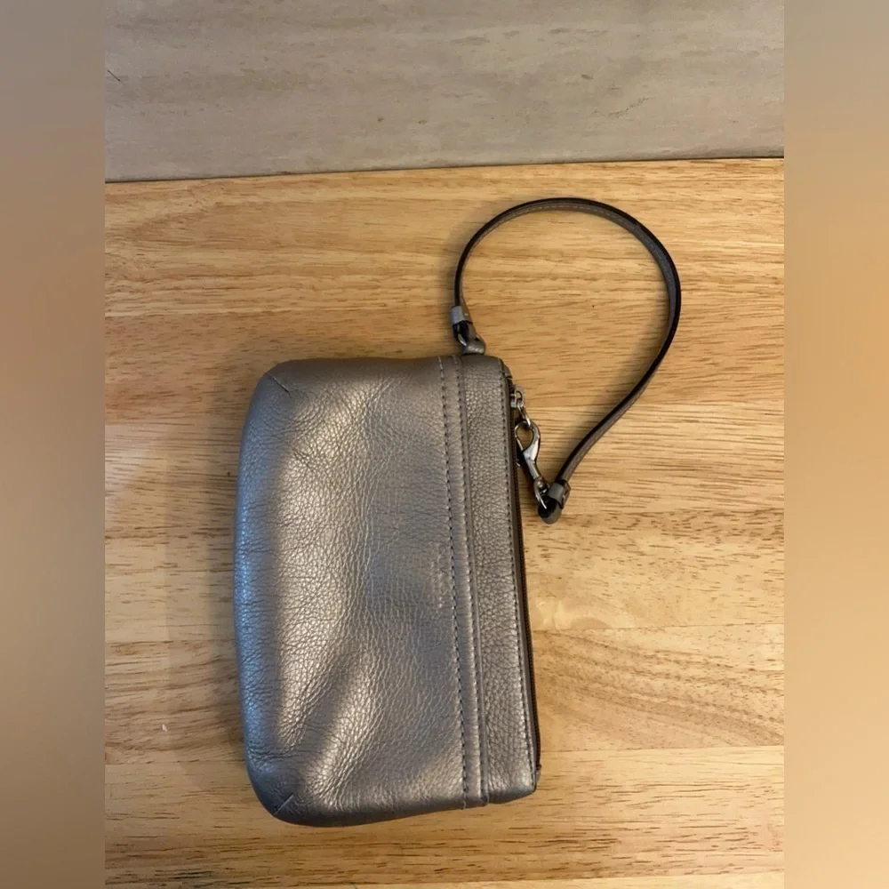 Coach metallic leather wristlet clutch purse.